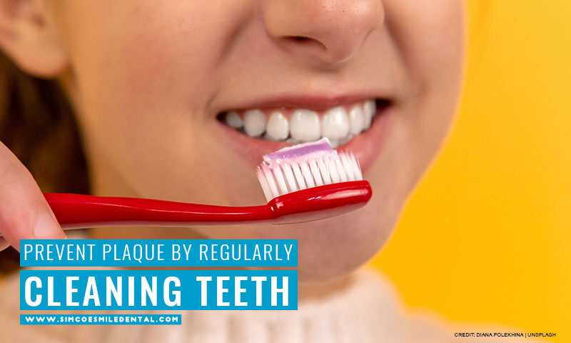 Prevent plaque by regularly cleaning teeth