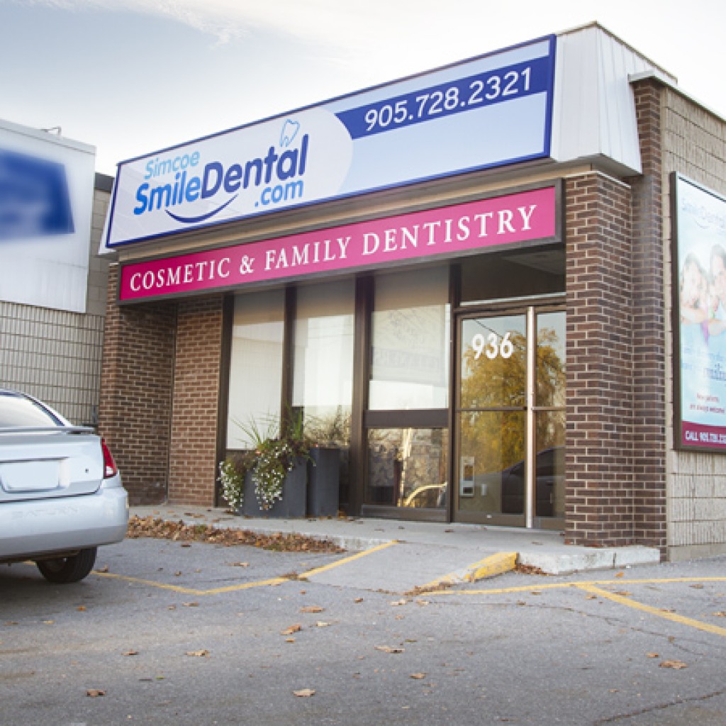 Simcoe Smile Dental storefront at 936 Simcoe Street North with parking out front